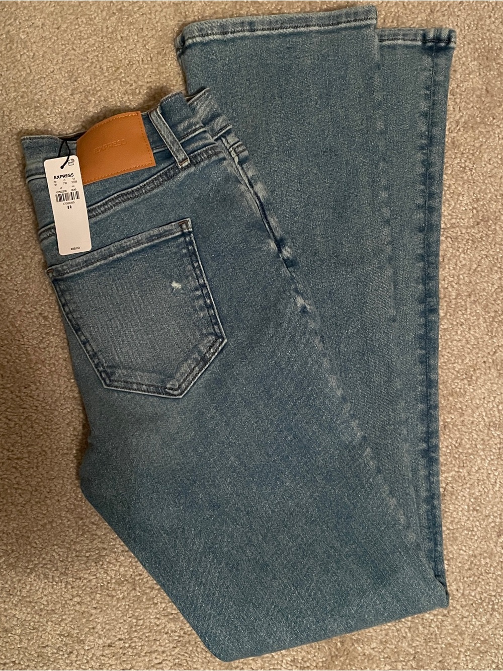 Express Women's Straight leg Jeans - Medium Blue Wash. Size 8R.